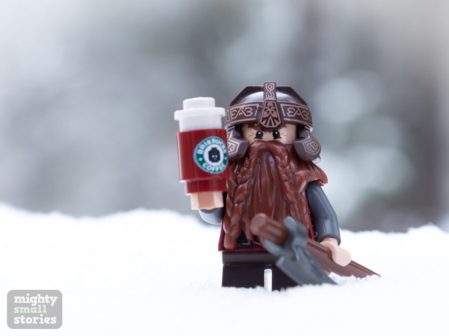 LEGO Gimli standing in the snow with coffee - by @mightysmallstories on Instagram